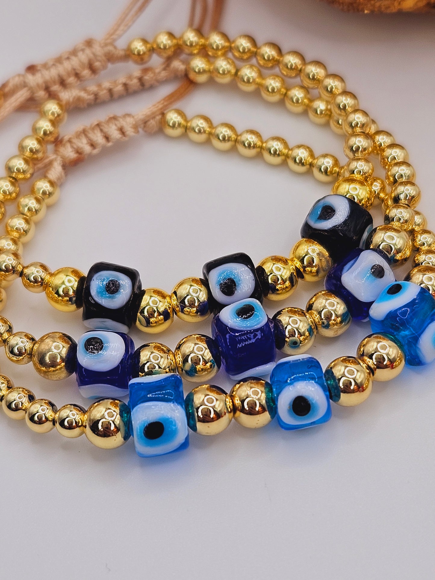 Triple pendant evil eyes beaded bracelet